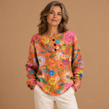 Róisín - Vibrant Orange Jumper with Colourful Floral Design