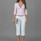 Elegant top with a lace V-neck and long sleeves
